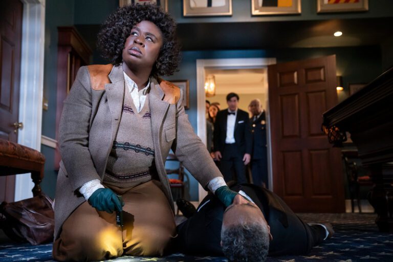 Uzo Aduba kneeling over the body of Giancarlo Esposito in Netflix's The Residence.