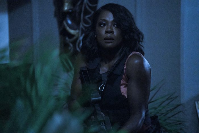 Viola Davis President Danielle Sutton (Viola Davis) looking alert as she holds a gun in the movie G20.