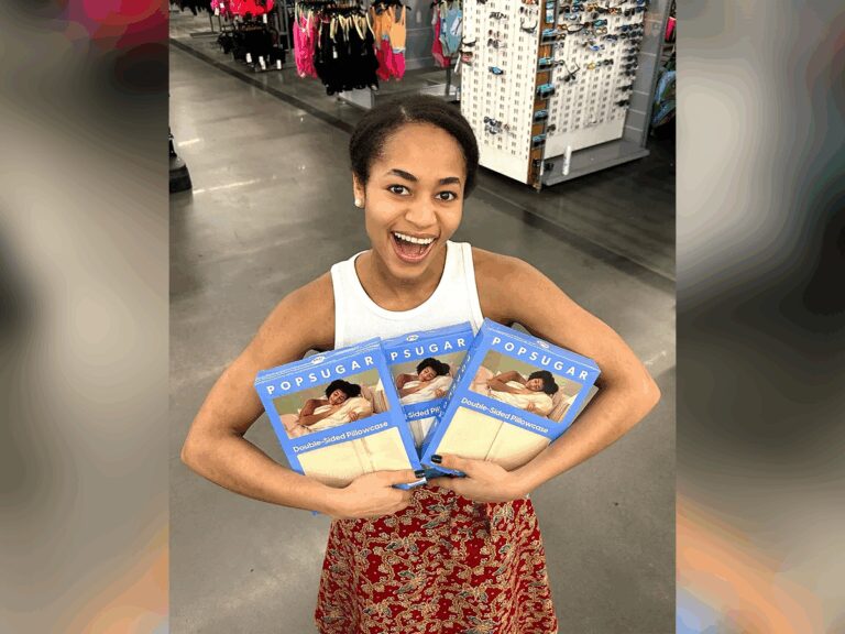 Sarah Murray in a Walmart, smiling and holding several PopSugar boxes with her photo on them.
