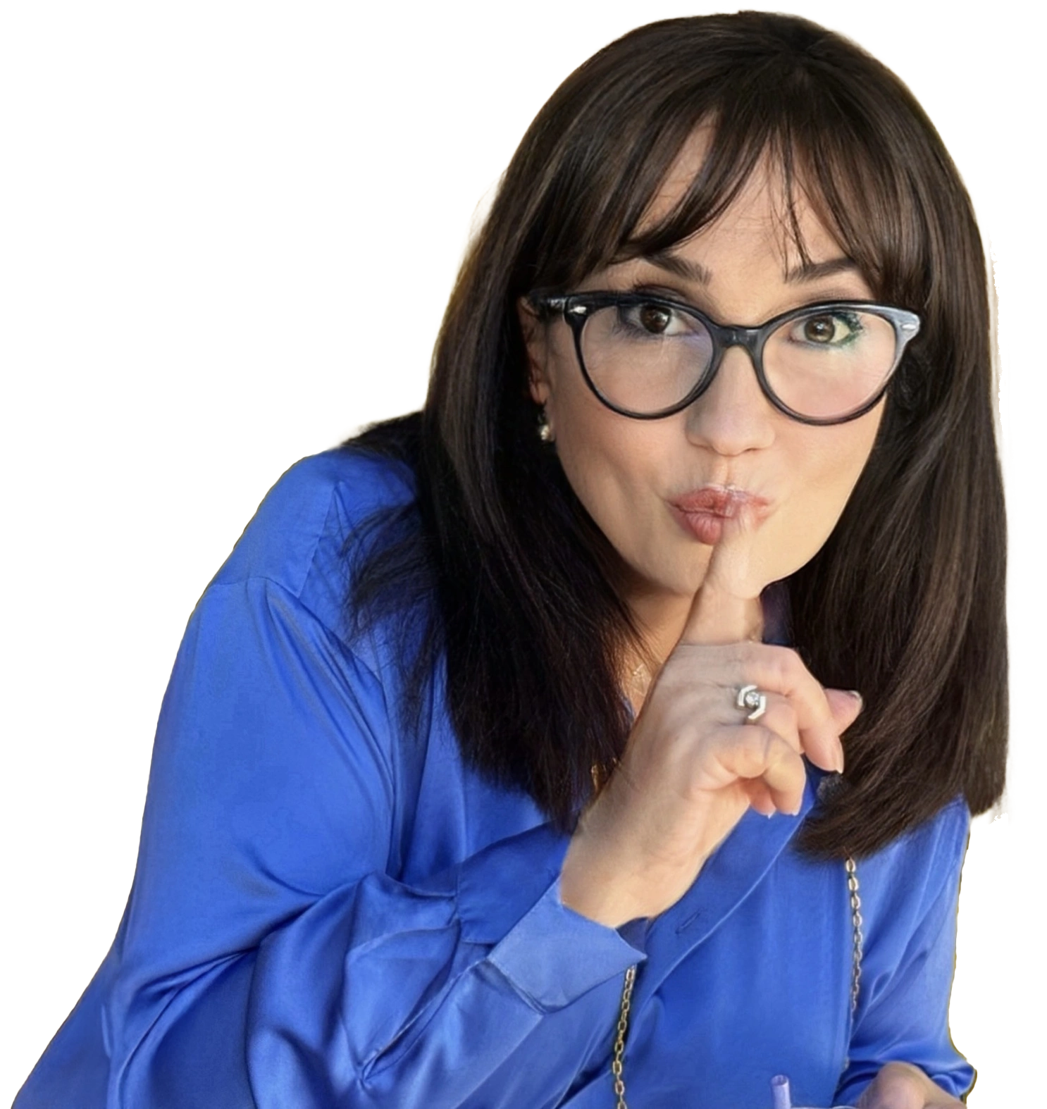 Casting director Rose Rosen wearing a blue shirt making a shushing gesture.
