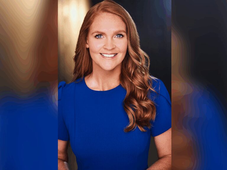 Casting Director Bella Hibbs smiling in a blue dress.
