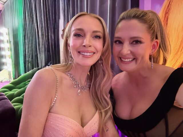 Lindsay Lohan and Kimberly Bigsby smiling in nice dresses at Freakier Friday premiere.